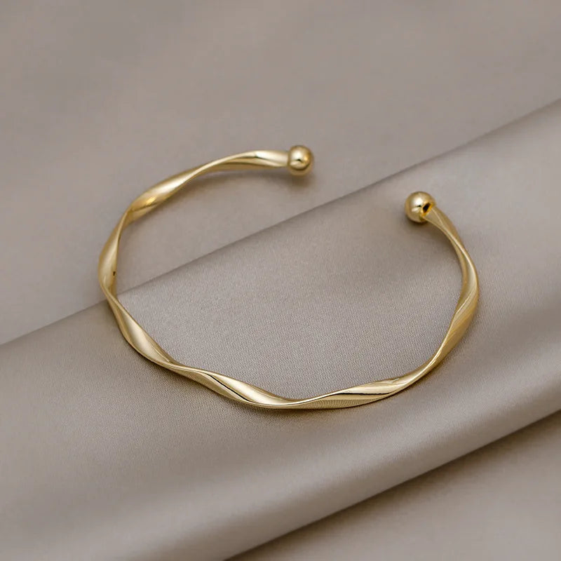 Women's Golden Charm Bangle – Minimalist Twisted Cuff Bracelet, Trendy Wedding & Gift Jewelry